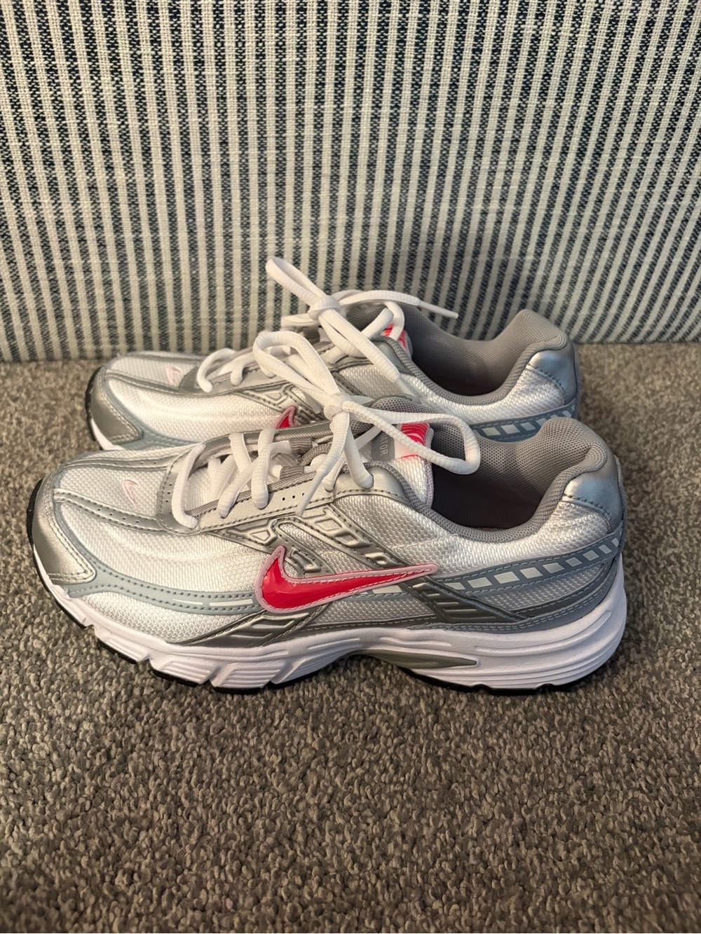 Nike Women's White and Silver Running Shoes with Pink Swoosh